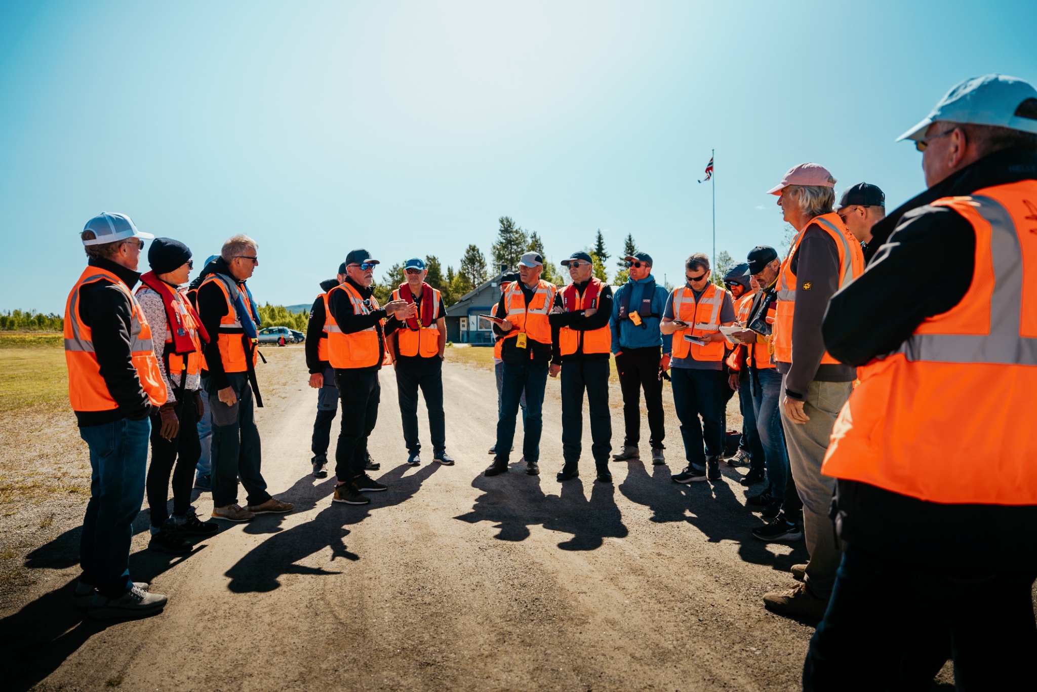 Pilots briefing in orange safety vests